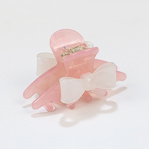 Pink translucent acrylic bow hair claw clip with cream white ribbon for women hairstyle