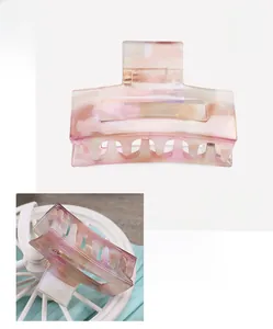 Detail view of pink marble acetate hair claw showing dimensions 6x4cm and 15.2g weight