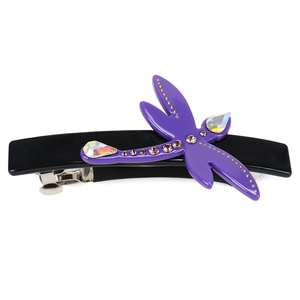 Detailed close-up of a dragonfly hair clip with purple rhinestones on black base