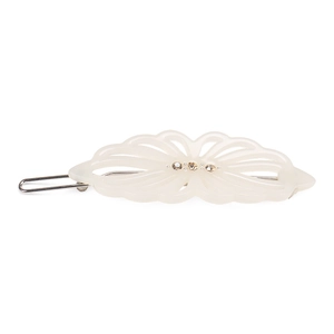 Detail of hollowed cream acetate hair clip with three inlaid yellow rhinestones
