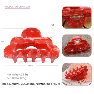 Detail view of 8.5cm red cloud hair claw clip with resin marble texture and metal spring