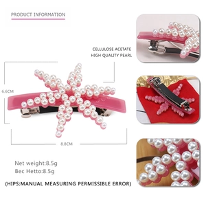 Pink acetate starfish hair clip with elegant pearl embellishments and spring fastener