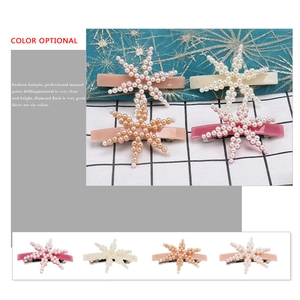 Elegant starfish hair clip with faux pearl embellishments in multiple pastel colors