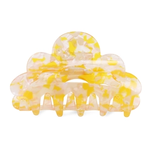 Macro view of a large translucent floral acetate hair claw with a silver spring clip