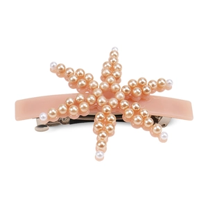 Detail view of pearl starfish spring clip hair accessory with peach acetate base