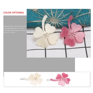 Floral clover hair clips in cream white and lavender purple with hand-set rhinestones