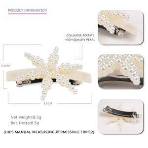 Elegant starfish hair clip with pearls and cellulose acetate finish on white background