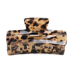 Detailed view of large tortoise shell acetate hair claw clip with glossy rectangle design