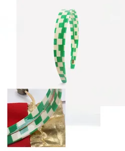 Detail view of green checkered cellulose acetate headband with dimensions and 24.3g weight