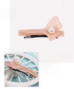 Pale pink acetate ginkgo leaf hair clip with pearls and metal spring closure