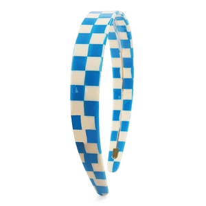 Close-up of blue and white checkered headband made of glossy resin with a retro style