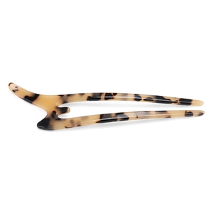 Macro shot of U-shaped hair fork with leopard print pattern made of cellulose acetate