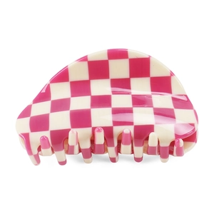 Detail view of pink checkerboard acetate hair claw clip with glossy finish and strong grip