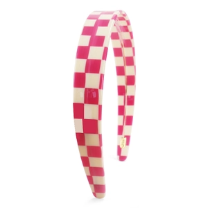 Detail of pink and beige checkered wide headband made from glossy acetate material