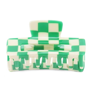 Detail of green and white checkered hair claw clip made of premium acetate for women