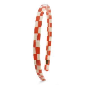 Detail shot of the red and white checkered headband featuring inner non-slip teeth for grip