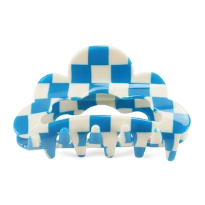 Detailed close-up of blue and white checkerboard cloud hair claw clip with multi-tooth grip