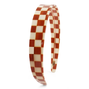 Macro view of high-gloss checkered headband with brown and cream resin finish