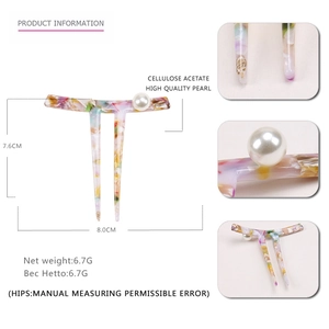 Elegant acetate marble pattern hair pin with two teeth and large white pearl accent