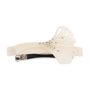 Detail of cream white hair clip featuring delicate rhinestones and pearls on acetate