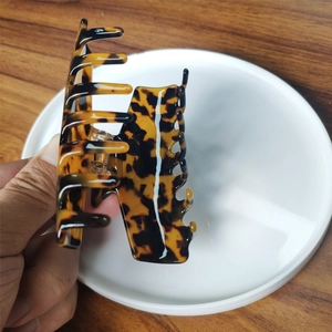 Minimalist large acetate claw clip for hair with dark amber tortoiseshell pattern
