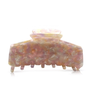 Large acetate hair claw clip with pink yellow and purple marble pattern for women