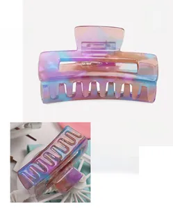 Macro shot showing dimensions and colorful marble texture of this acetate claw clip