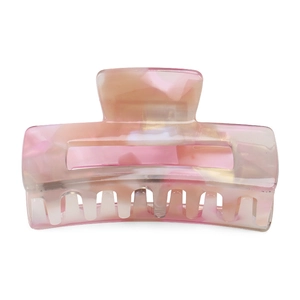Detailed macro view of pink marble acetate hair claw clip with smooth polished texture