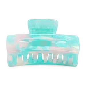 Macro view of blue marbled acetate hair claw clip showing polished texture and spring detail