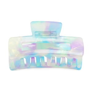 Detail of colorful gradient acetate hair claw clip with smooth translucent marble finish