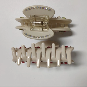 Creamy white hair claw clips with cherry rhinestone design and metal spring structure