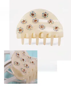 Detail of acrylic hair claw with rhinestones showing 7.5x5.3cm size and 29.3g weight