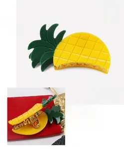 Detail view of yellow acrylic pineapple hair claw clip with size and weight parameters