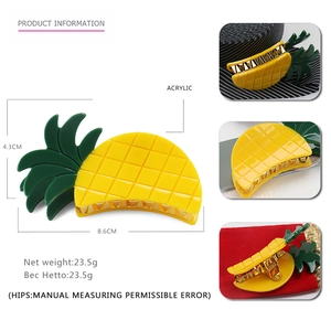 Cute yellow acrylic pineapple hair claw clip with measurements and green leaf detail