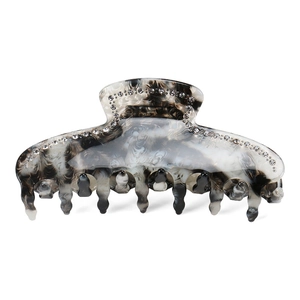Detail view of large marble texture shark clip with sparkling rhinestones and strong grip