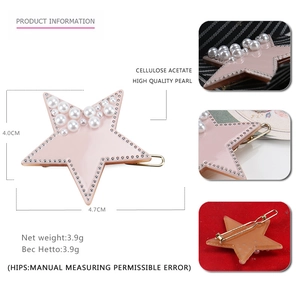 Detailed view of pale pink acetate star hair clip with pearls and silver rivets