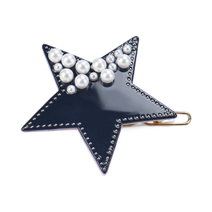 Star-shaped dark blue acetate hair clip with white pearls and gold-tone metal base