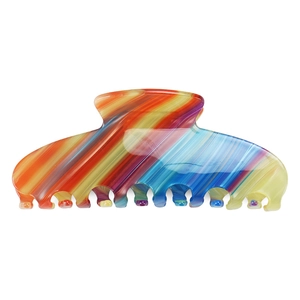 Close-up of extra large rainbow striped acetate hair claw clip with smooth polished finish