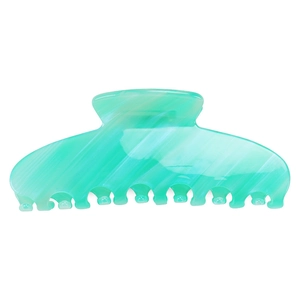 Macro detail of mint green acetate hair claw clip with elegant marble pattern texture