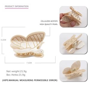 Pince à cheveux papillon en acétate avec perles et lignes dorées, style français