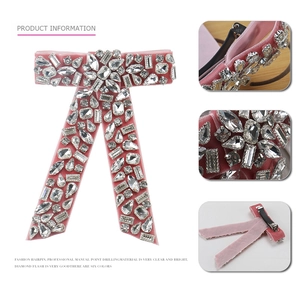 Detailed views of luxury velvet bow hair clip with crystal rhinestones and spring fastener