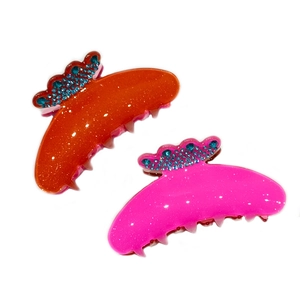 Sparkly acetate hair claw clips set in orange and pink with rhinestones for women