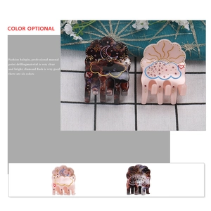Cloud-shaped acetate hair claw with rhinestones in tortoiseshell and soft pink patterns