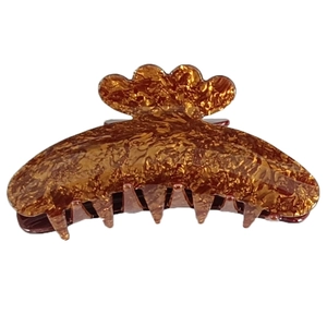 Close-up of a vintage amber tortoiseshell cloud-shaped acrylic hair claw clip for women