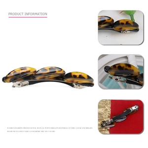 French tortoise acetate geometric oval spring hair clip with brown marble pattern