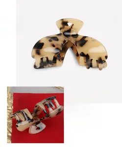 Detail view of acetate claw clip with leopard tortoise pattern showing size and 6.8cm dimensions