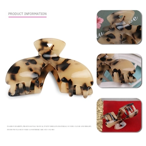 Elegant tortoiseshell hair claw clip in beige and brown for women's hair styling