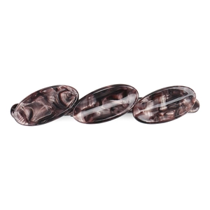 Close-up of geometric acetate spring hair clip with marbled oval pattern and glossy finish