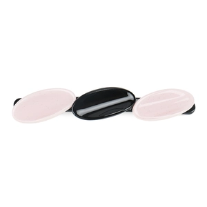 Detailed macro view of geometric oval acetate hair clip with pink and black marble pattern