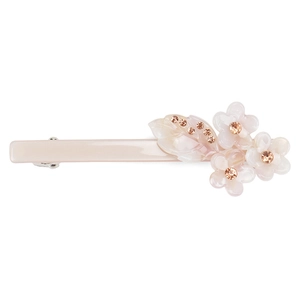 Detail der Haarspange aus Acetat mit Blumenmuster und glitzernden Strasssteinen